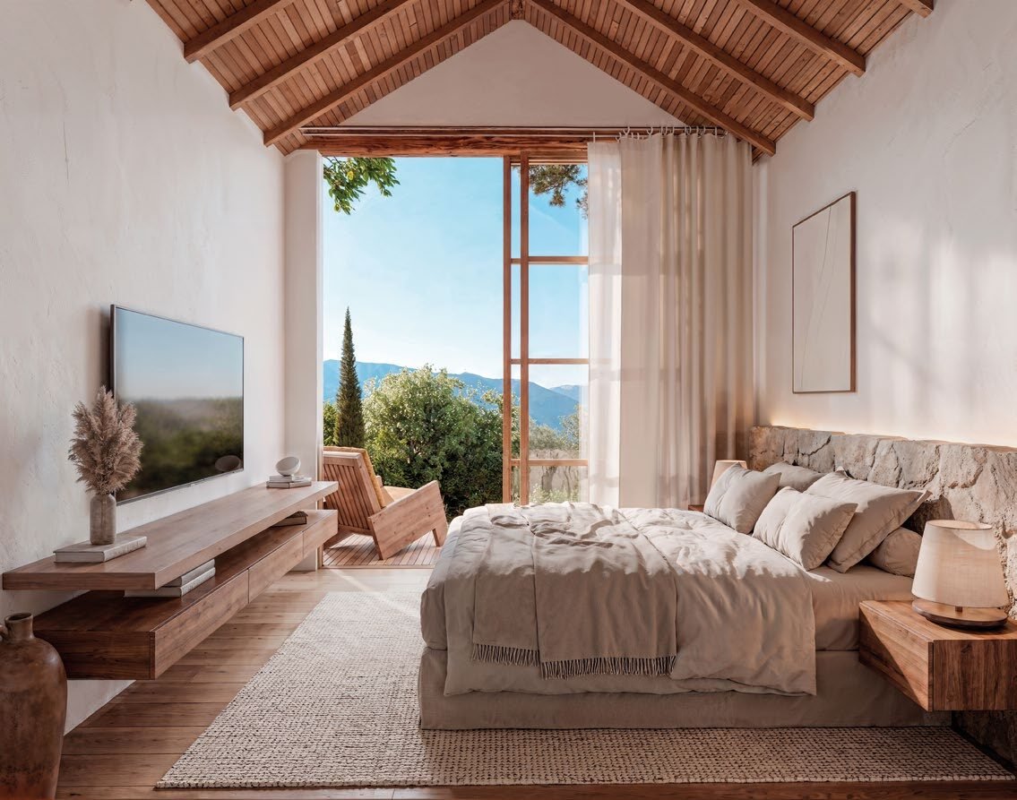 Interior da cabana com cama, vista para a paisagem e acabamento em madeira